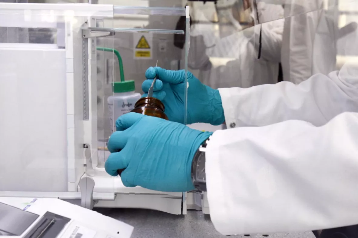 Microscopic analysis of particle contamination on a lab surface.
