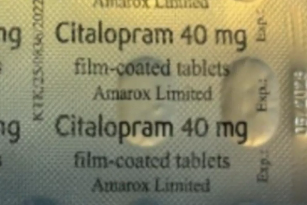 Pharmacist checking medication packaging for correct antidepressant labels