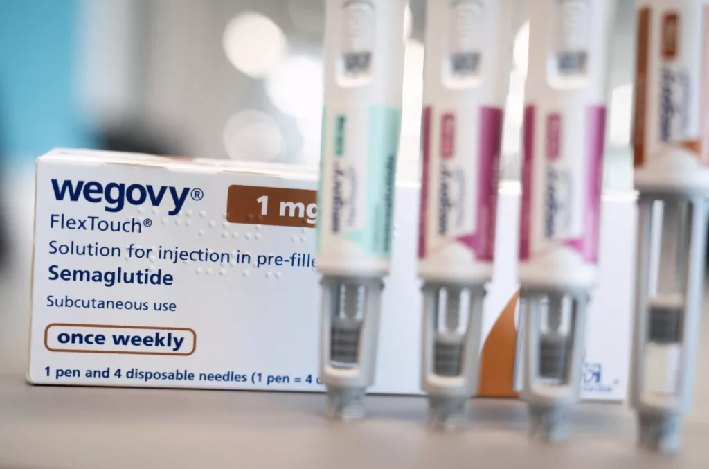Patients face difficulties with weight-loss drugs like Wegovy, new research reveals cause A scientist analysing genetic data in a modern laboratory setting.