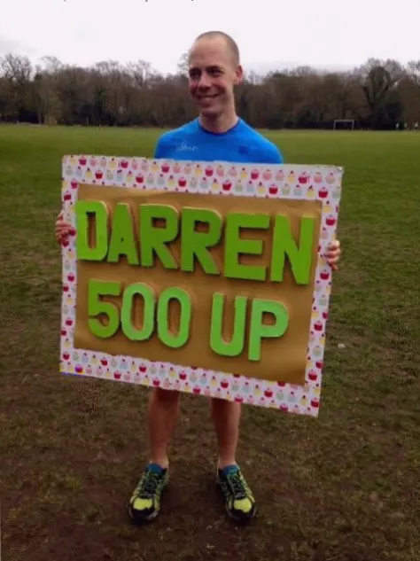 Volunteers in high-vis vests directing participants at a parkrun