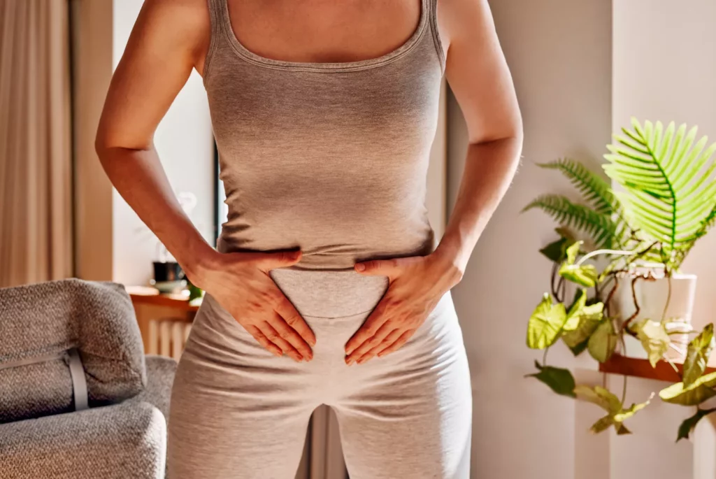 Age-based clues your pelvic floor requires attention Woman sitting comfortably performing a pelvic floor exercise at home
