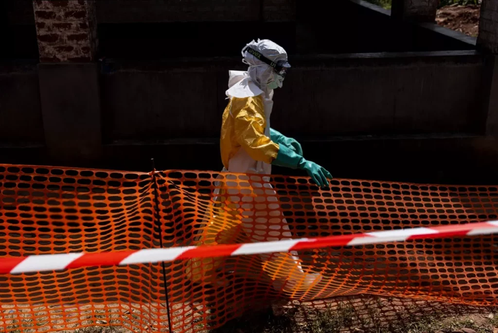 Ebola crisis forces World Cup co-hosts to bolster fan safety precautions Airport screening checkpoint with health officials checking passengers at a North American terminal