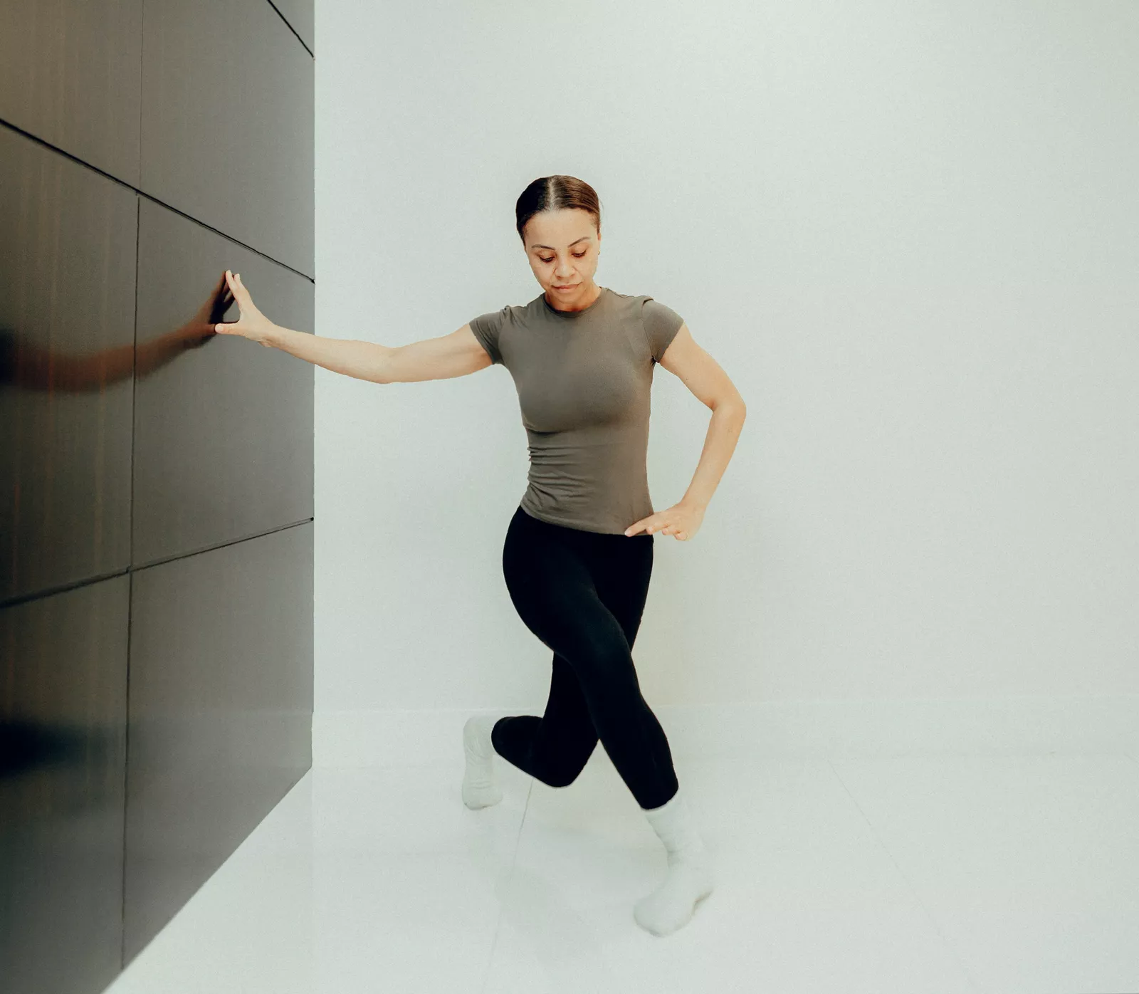 Bird dog exercise on a mat, engaging core and back muscles