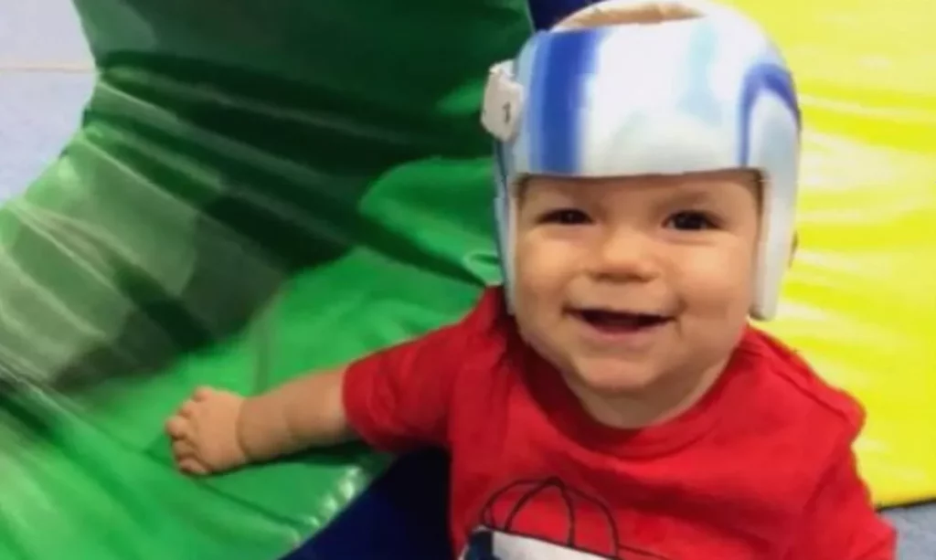 Young boy with Sanfilippo syndrome at home with his mother in a quiet living room