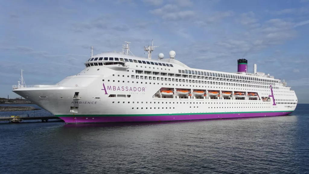 Cruise ship docked at a port in Bordeaux with passengers confined onboard due to illness