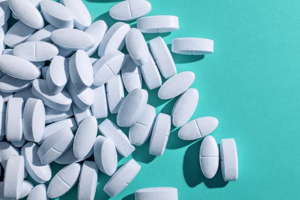 Pharmacies in UK could be granted wider prescribing powers from autumn under fresh proposals A pharmacist in a white coat consults with a patient at a community pharmacy counter in England.