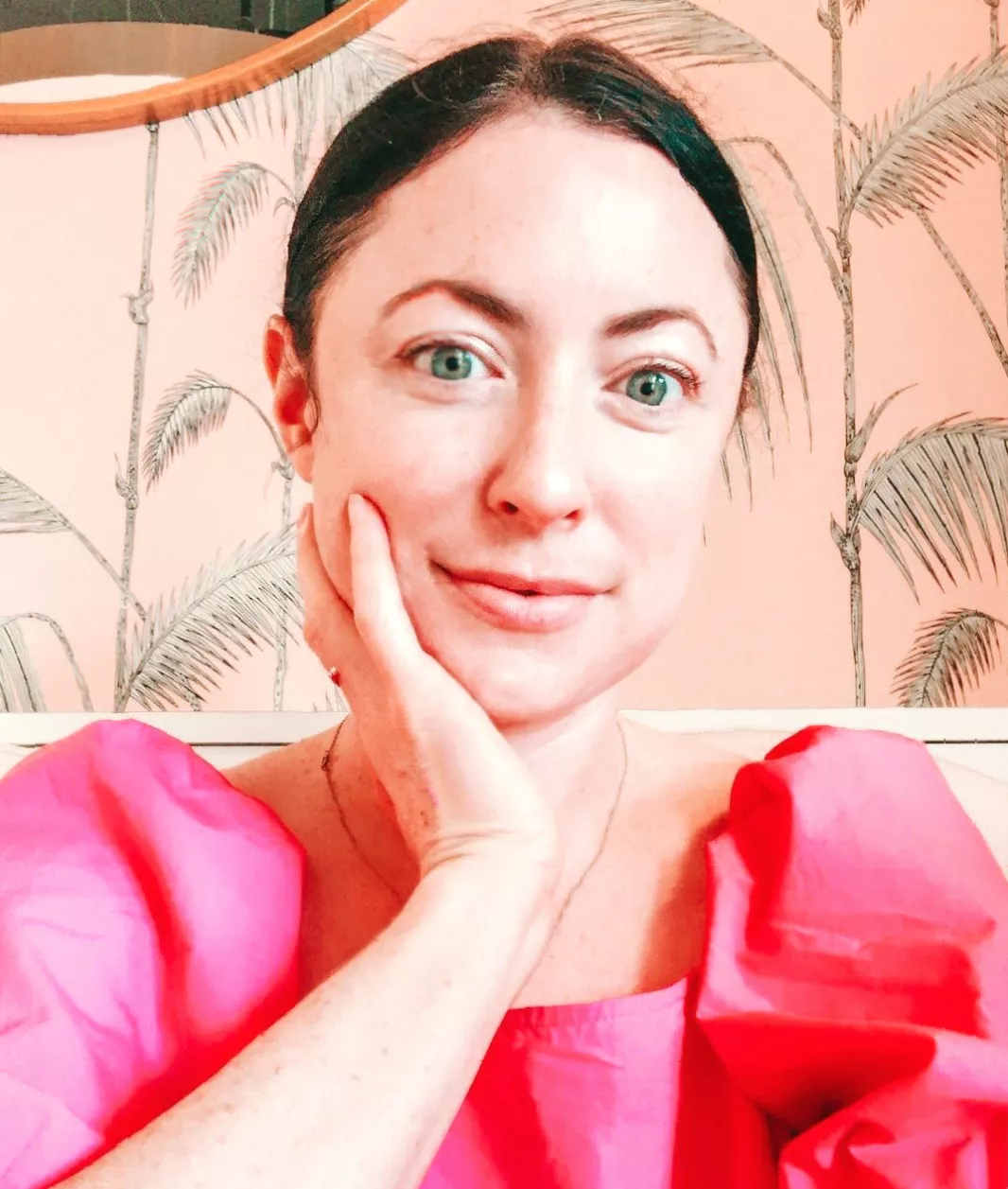 A woman sitting in a therapist's office, discussing complex emotions about motherhood