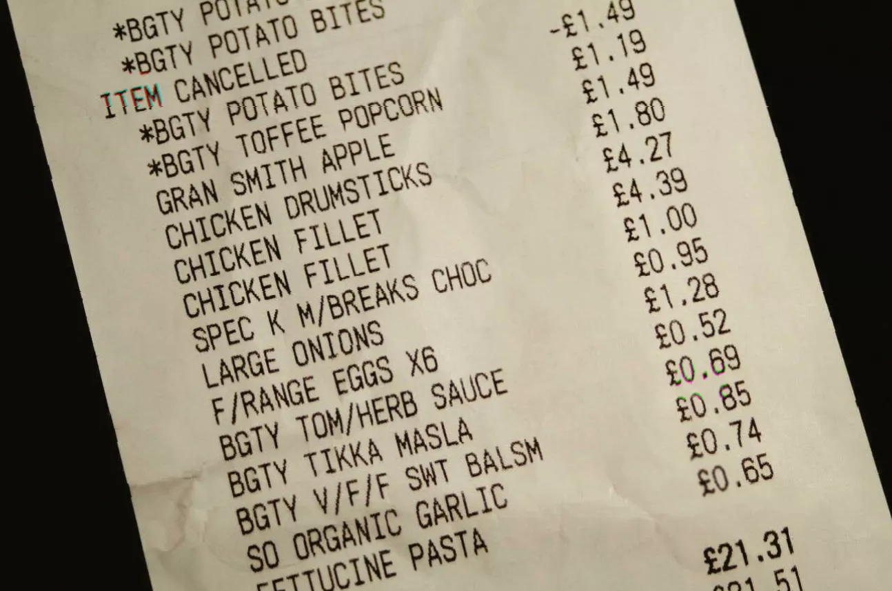 Supermarket shelf with a recalled food product labelled with a safety warning notice