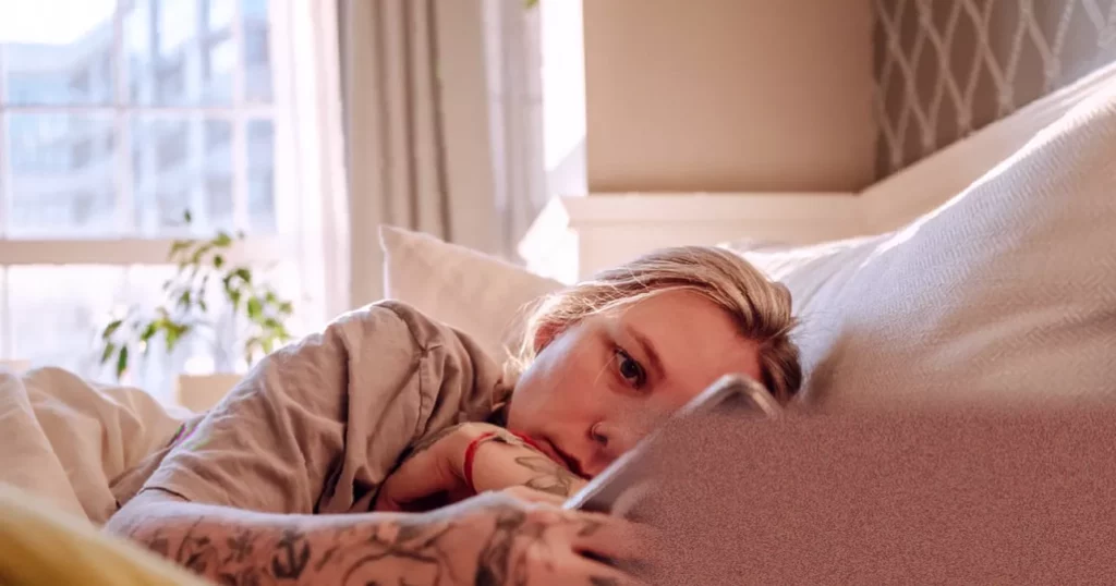 Sleep difficulties associated with increased cancer risk in under-50s Doctor reviewing sleep and cancer data on a computer screen in a medical office