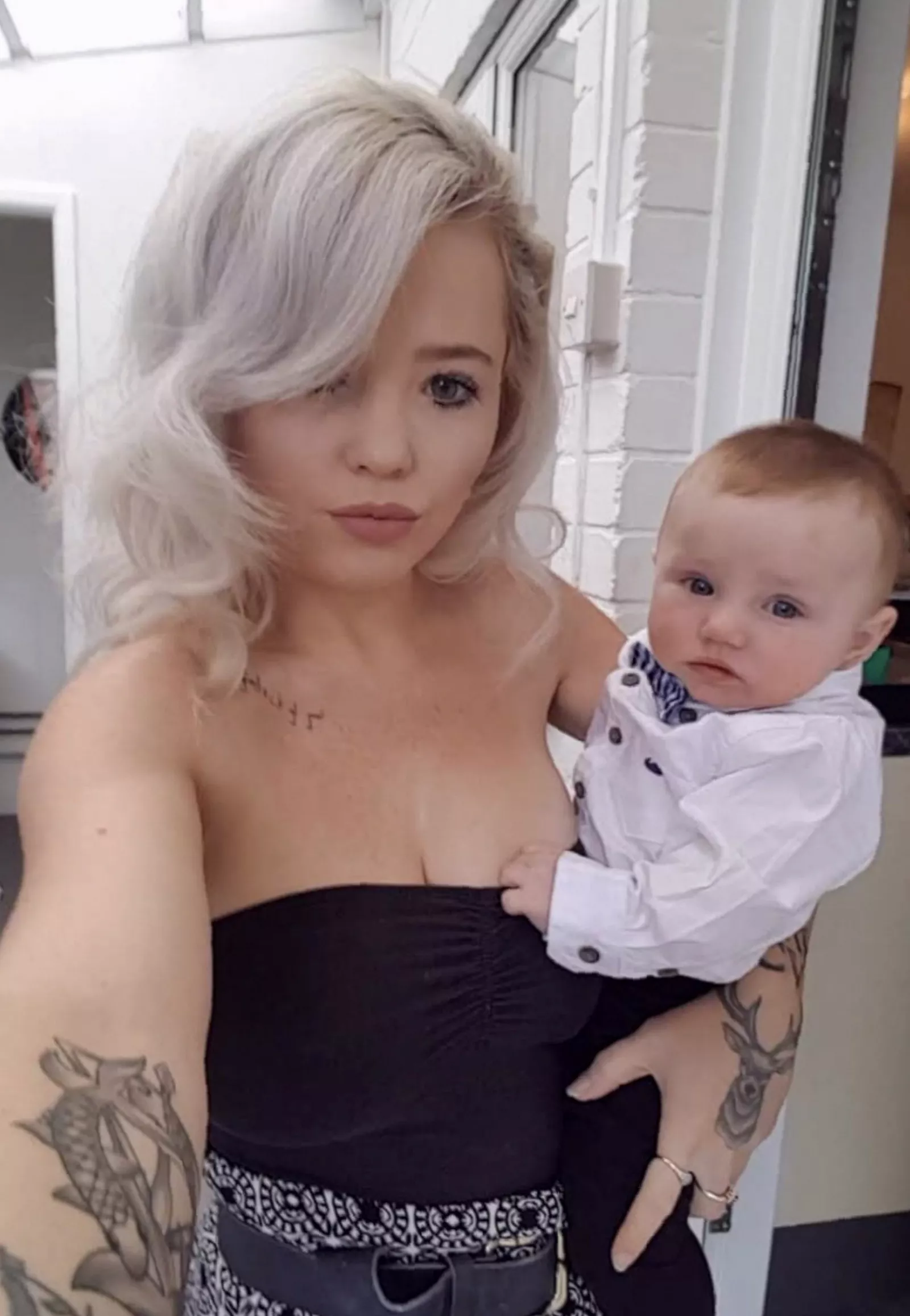 Mother and son sitting together at home, both affected by the same rare genetic condition