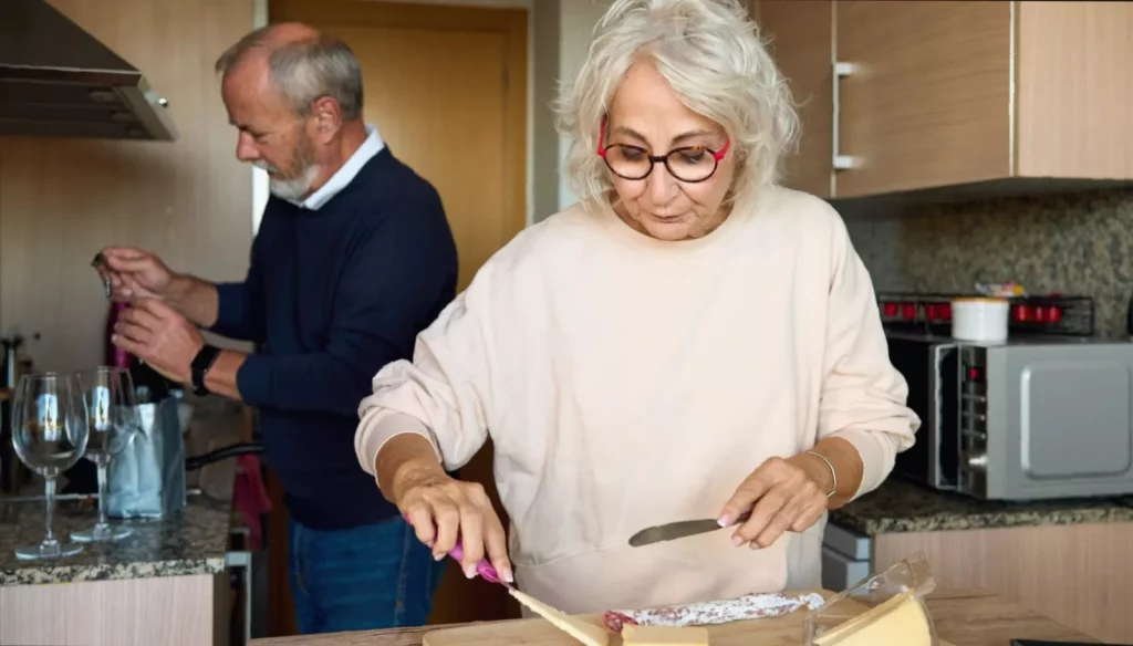 Uncommon tips for reducing blood pressure A person checking their blood pressure at home with a digital monitor on a kitchen table