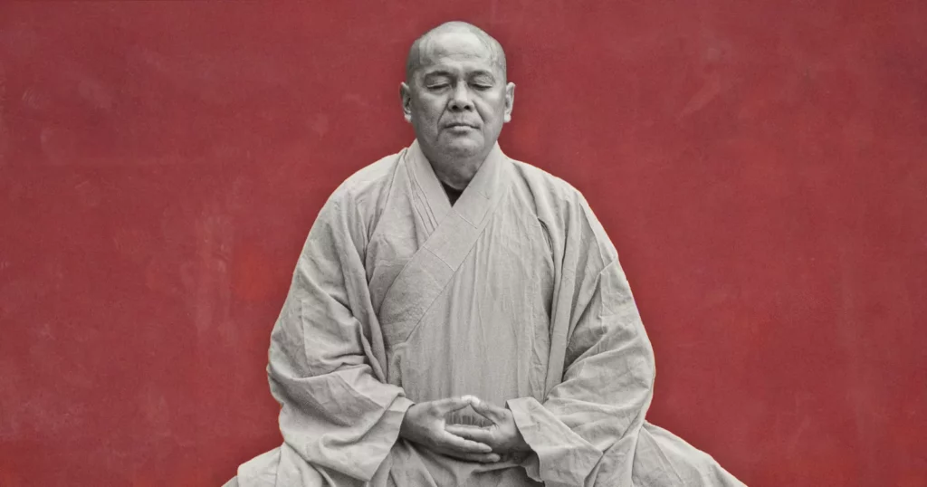 2026’s monk mode: manosphere trick or imperative A teenager sits alone in a dimly lit room, phone face down on a desk, surrounded by books and a notebook.