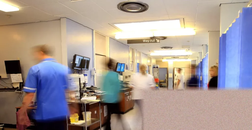 A&E delays linked to more than 1,300 deaths per month in England, figures indicate Crowded emergency department waiting room with patients on stretchers lining a corridor