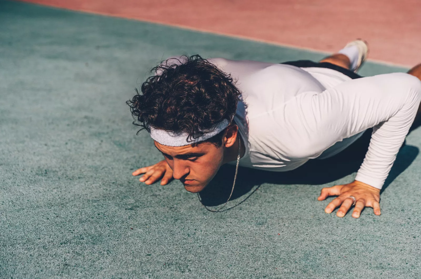Woman doing incline push-ups on a low bench to build upper-body strength gradually