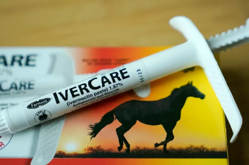 Increase in cancer patients choosing ivermectin over chemo, analysis reveals Cancer patient holding ivermectin tablets and a chemotherapy bag on a hospital bed