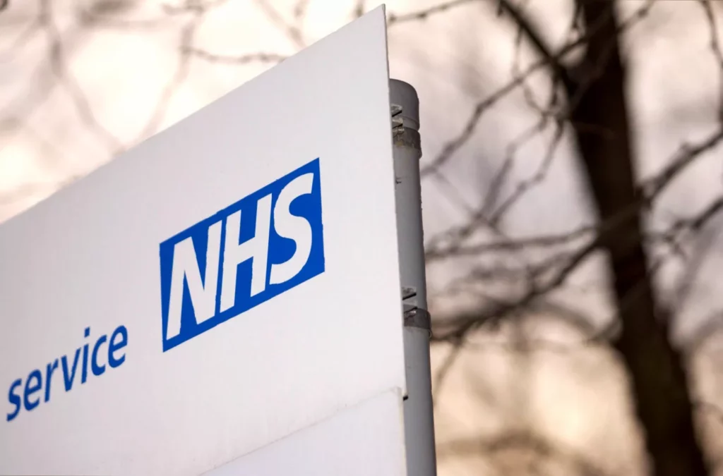 NHS doctors deterred from sectioning psychotic black patients over race bias fears An NHS psychiatric ward corridor with a secured entrance and clinical lighting