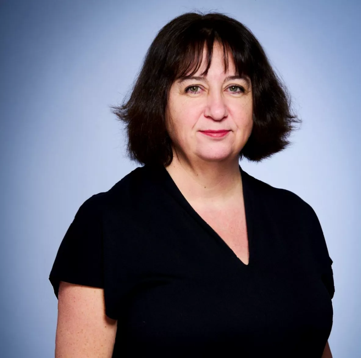 Row of glass bottles containing lithium water supplements on a pharmacy shelf
