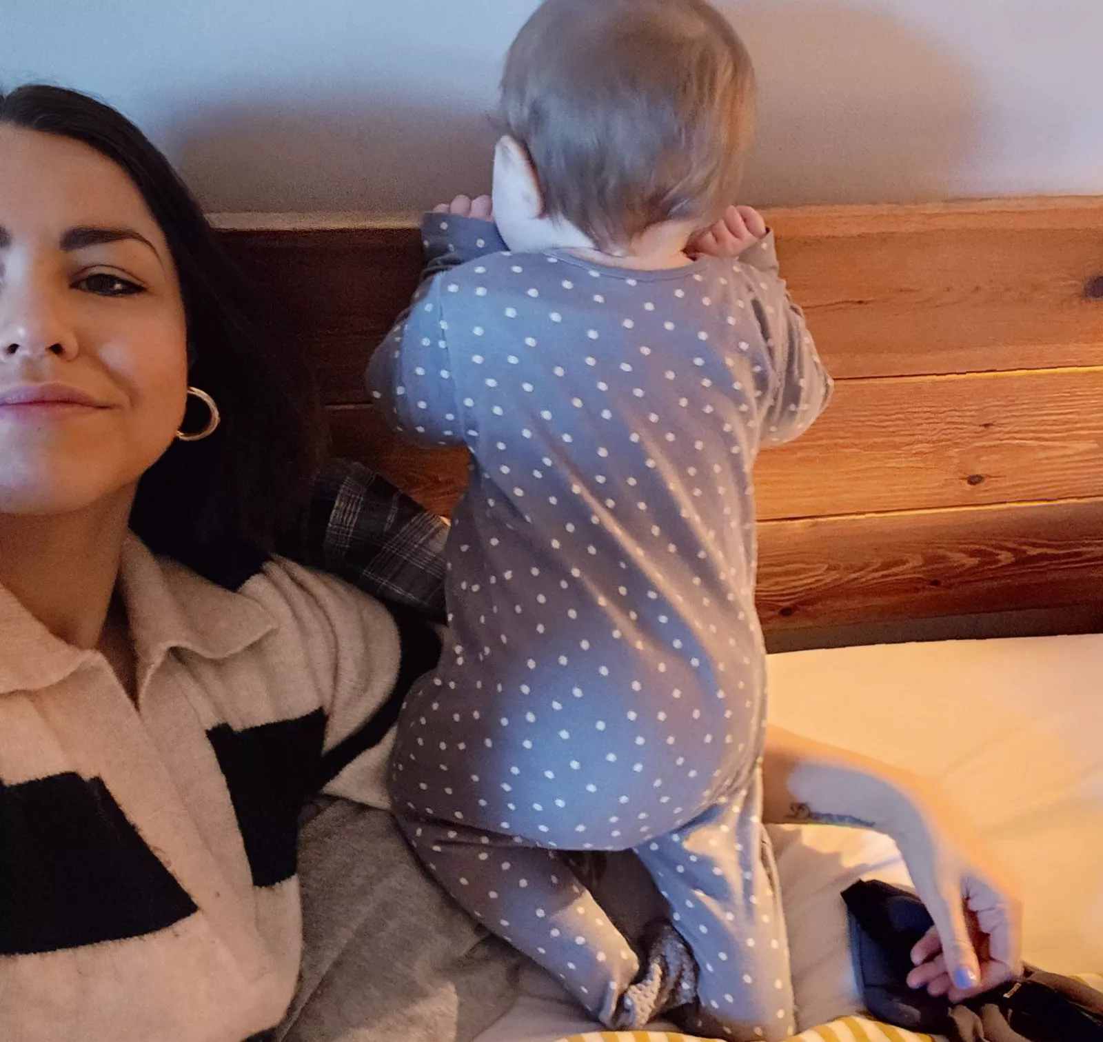 Mother using a sleep tracking app on her phone