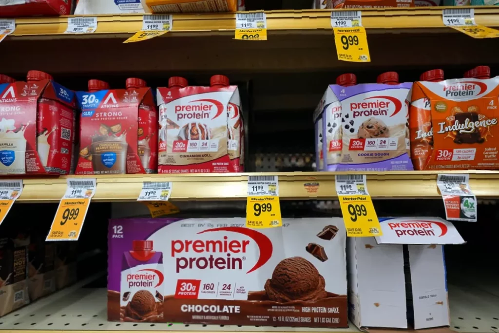 Rising demand for high-protein foods sparks shortage fears Supermarket shelf stocked with various whey protein powder tubs and supplements