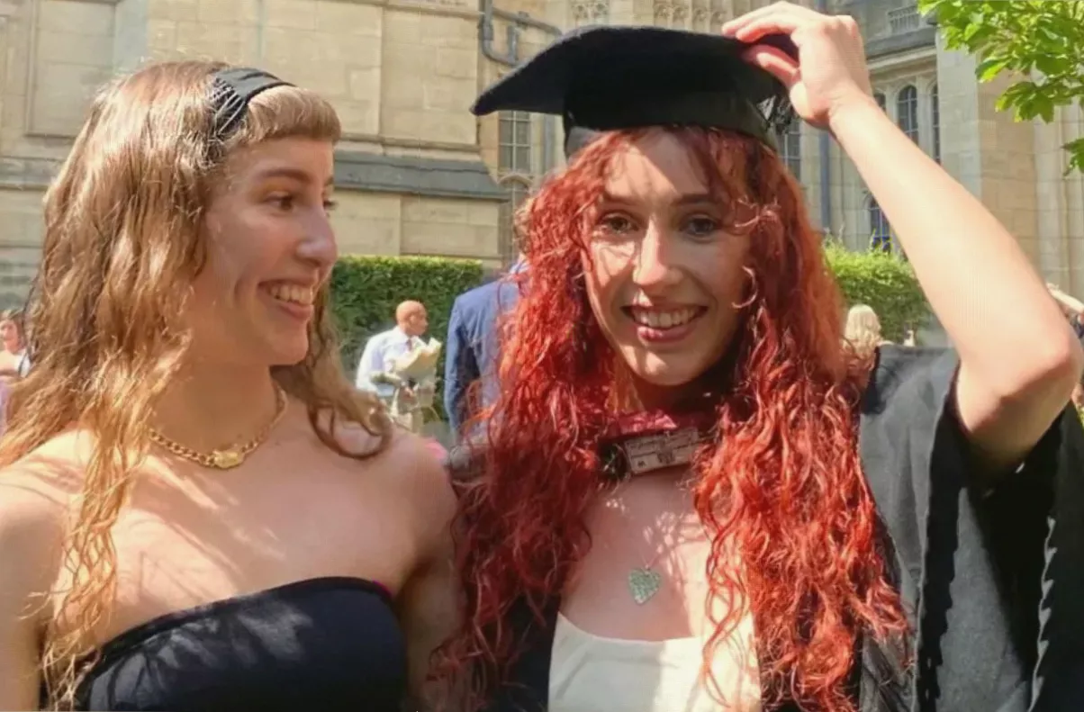 Identical twin sisters at a hospital after genetic testing ruled out a stem cell match