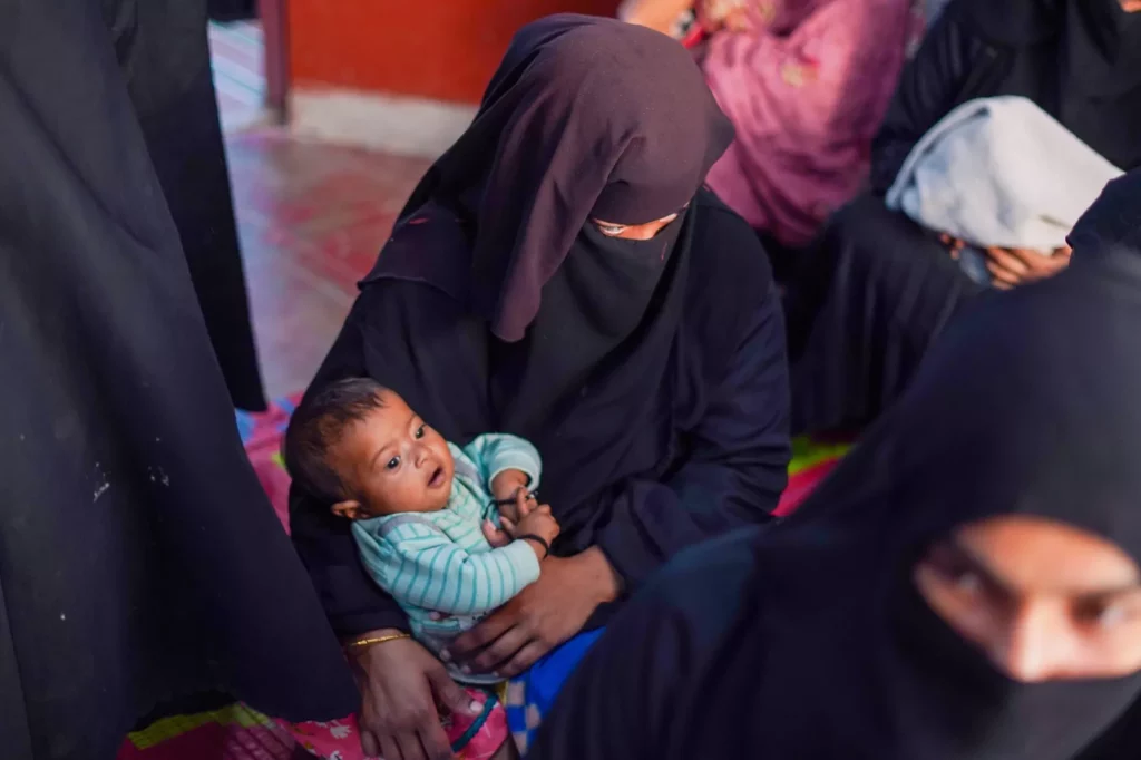 45C heat on Pakistani island threatens pregnant women and babies Aerial view of densely packed concrete homes on Baba Island off the coast of Karachi